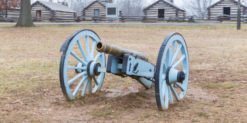 Cannon in front of log cabins at Valley Forge National Historical Park.