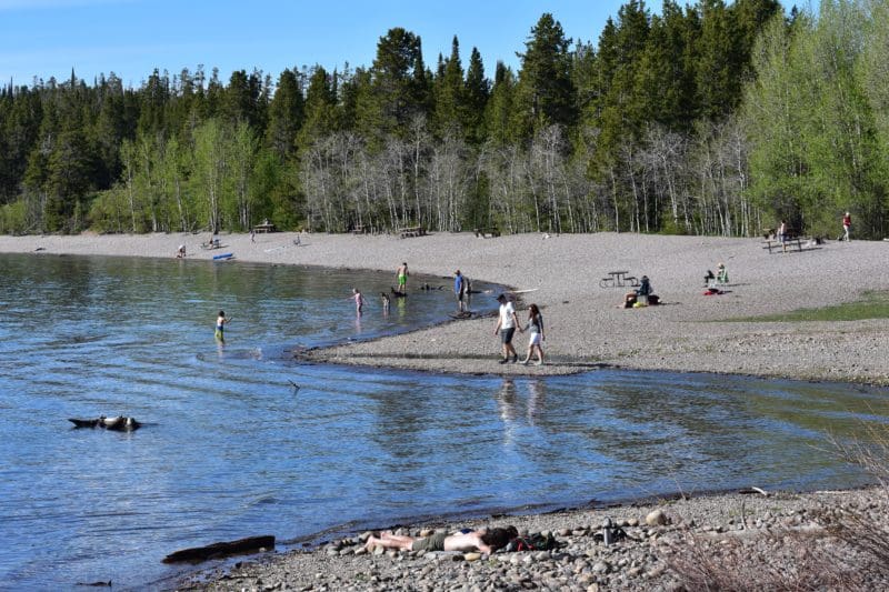 families playing in lake at Grand Teton National Park