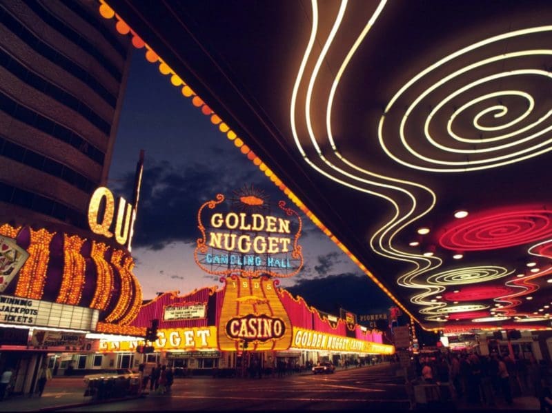 Golden Nugget and other Fremont Street hotels in downtown Las Vegas at night. Tips for finding a family hotel in Las Vegas. Photo credit: Pixabay
